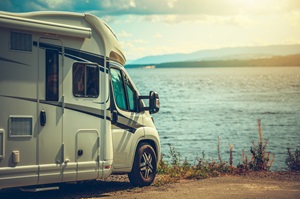 rv parked next to water